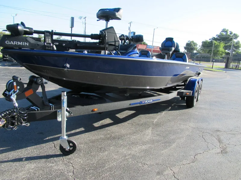 Slide: The Image of A 2027 Vexus AVX 1980 boat on a trailer, equipped with a Garmin system. - 10