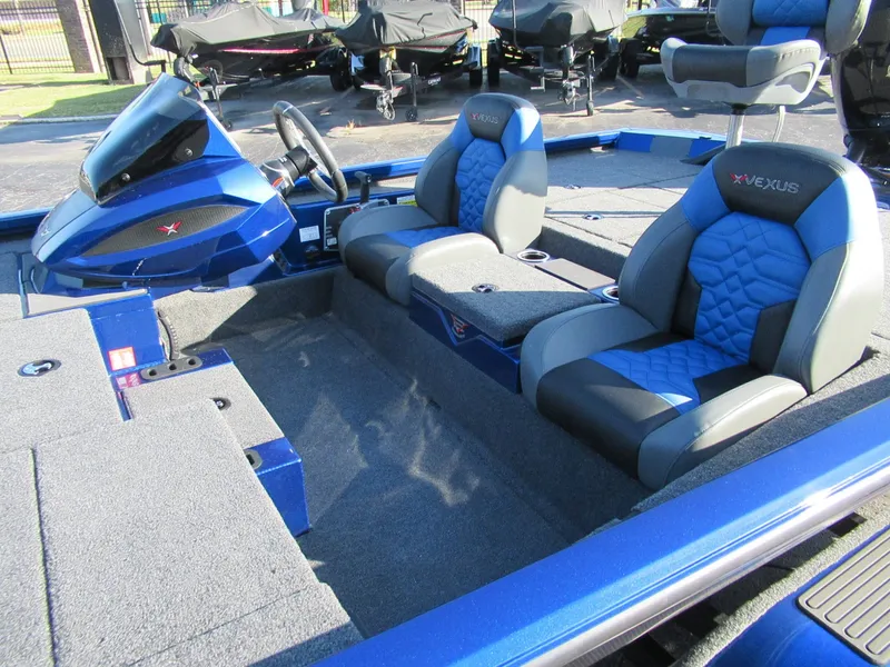 Slide: The Image of The image shows the interior of a 2027 Vexus AVX 1980 boat with blue and gray seats. - 3