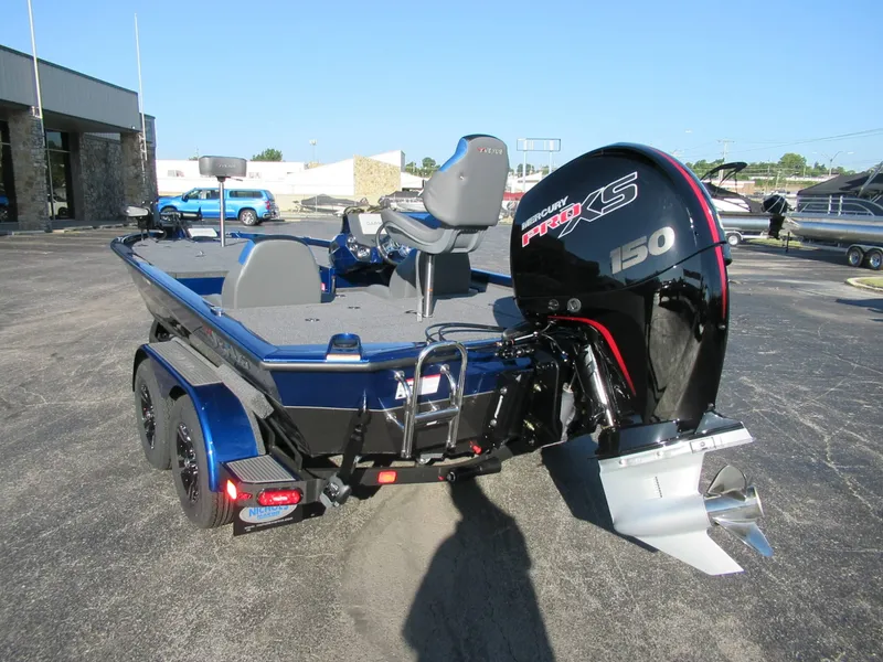 Slide: The Image of A 2027 Vexus AVX 1980 boat with a powerful outboard motor, parked on a trailer. - 4