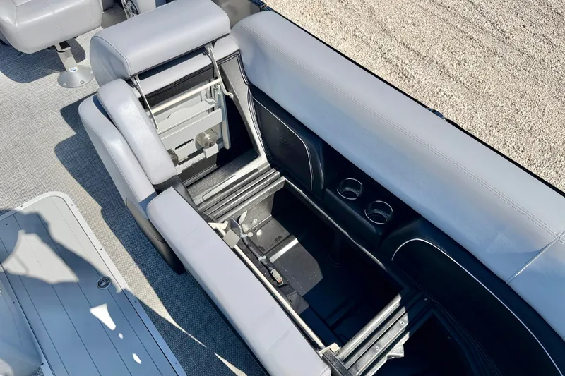 Slide: The Image of Interior view of 2027 Vanderbilt 23QS boat with open storage compartment. - 23