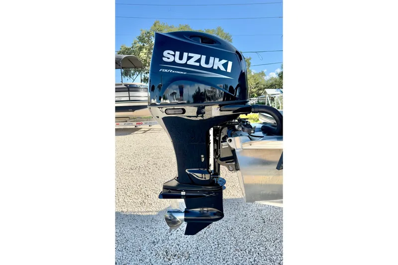 Slide: The Image of Suzuki four-stroke outboard motor on a 2027 Vanderbilt 23QS boat. - 33