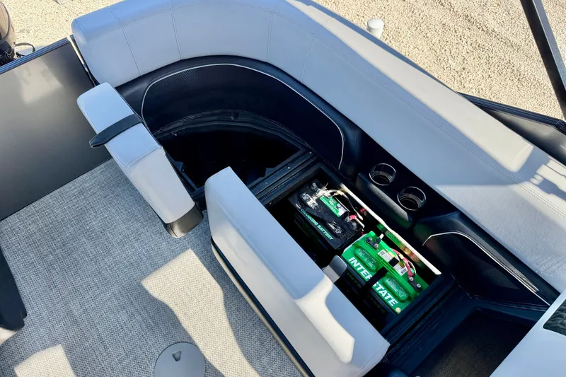 Slide: The Image of Interior of 2027 Vanderbilt 23QS boat showing seating and battery storage compartment. - 28