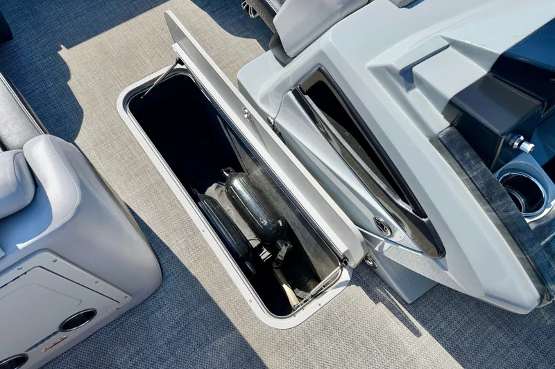 Slide: The Image of Storage compartment in a 2027 Vanderbilt 23QS boat, showcasing ample space and sleek design. - 24