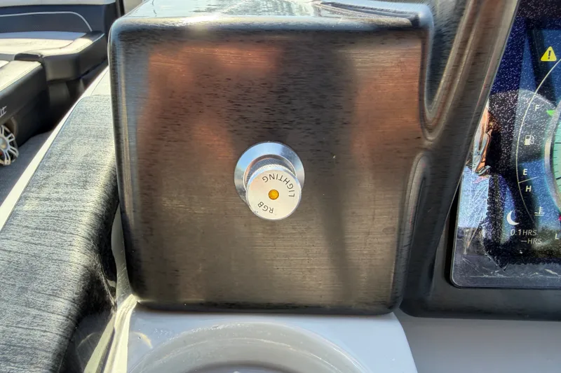 Slide: The Image of Dashboard of a 2027 Vanderbilt 23QS boat with lighting control knob. - 27