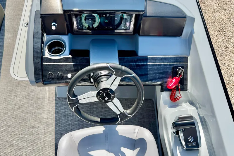 Slide: The Image of Steering console of 2027 Vanderbilt 23QS boat with modern controls and dashboard. - 14