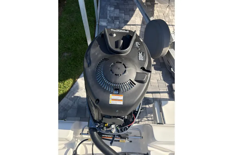 Slide: The Image of Top view of a 2027 Key West 179 FS boat engine on a paved surface. - 16