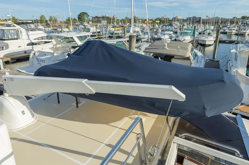 Slide: The Image of 2010 Grand Banks 41 Heritage EU yacht covered at marina, surrounded by boats. - 28
