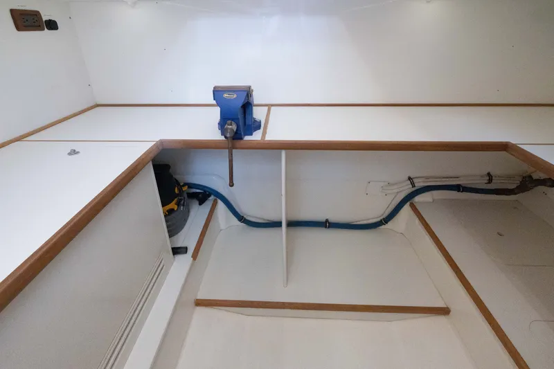 Slide: The Image of Interior of 2010 Grand Banks 41 Heritage EU with workbench and vise. - 34