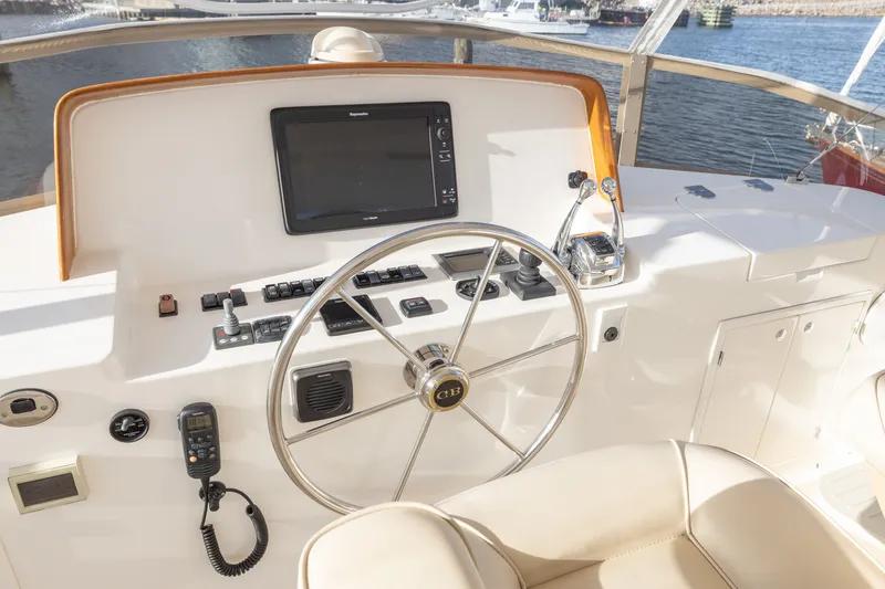 Slide: The Image of Helm of 2010 Grand Banks 41 Heritage EU yacht with steering wheel and navigation controls. - 26