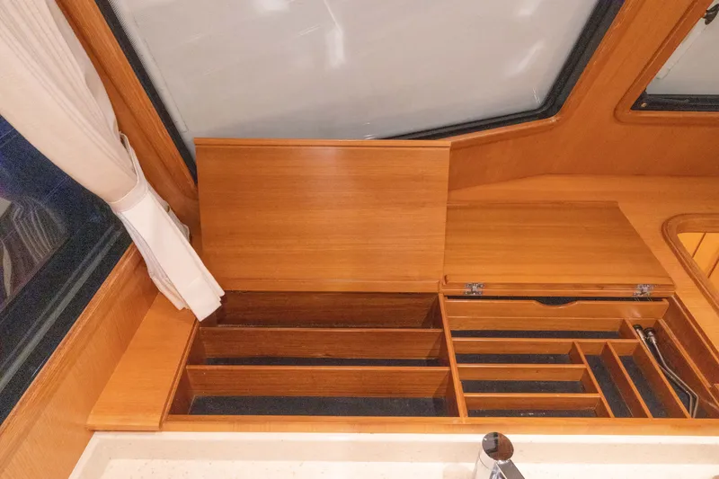 Slide: The Image of Interior of 2010 Grand Banks 41 Heritage EU yacht with wooden storage compartments. - 13