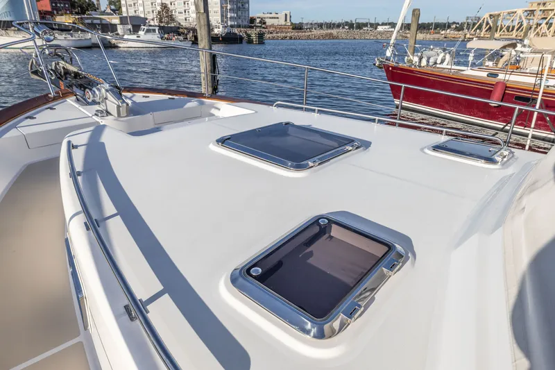 Slide: The Image of 2010 Grand Banks 41 Heritage EU yacht deck with hatches, docked in a marina. - 31