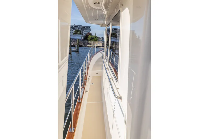 Slide: The Image of Side deck view of 2010 Grand Banks 41 Heritage EU yacht, showcasing sleek design and waterfront. - 29