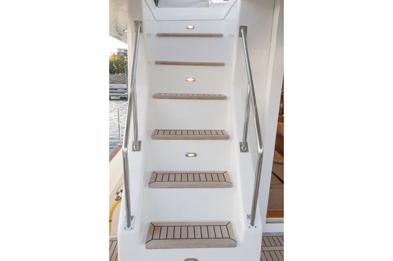 Slide: The Image of Staircase on 2010 Grand Banks 41 Heritage EU yacht with teak steps and stainless steel railings. - 25