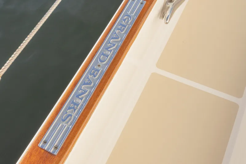 Slide: The Image of Close-up of 2010 Grand Banks 41 Heritage EU boat nameplate on deck. - 32