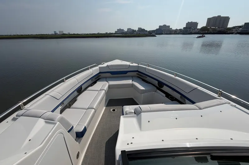 Slide: The Image of 2020 Formula 330 Crossover Bowrider I/O on calm water, featuring spacious seating. - 7
