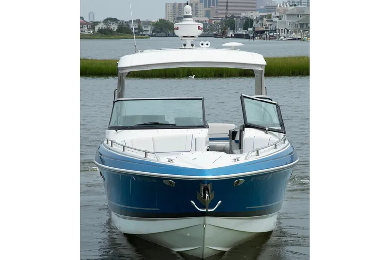 Slide: The Image of 2020 Formula 330 Crossover Bowrider I/O on water, front view. - 1
