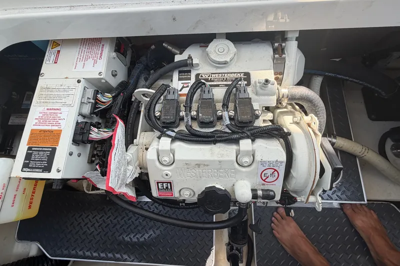Slide: The Image of Engine compartment of a 2020 Formula 330 Crossover Bowrider I/O with Westerbeke generator. - 23