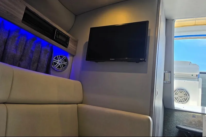 Slide: The Image of Interior of 2020 Formula 330 Crossover Bowrider with TV and blue LED lighting. - 20