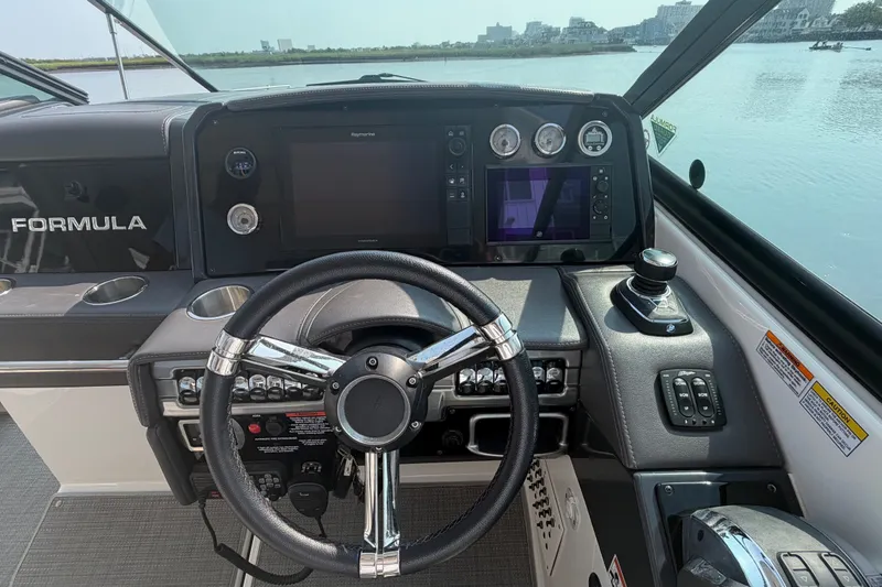 Slide: The Image of Helm of 2020 Formula 330 Crossover Bowrider I/O with modern controls and navigation system. - 10