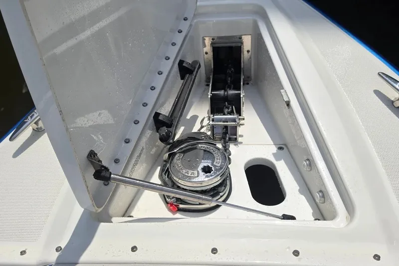 Slide: The Image of Open anchor compartment on 2020 Formula 330 Crossover Bowrider I/O boat. - 12
