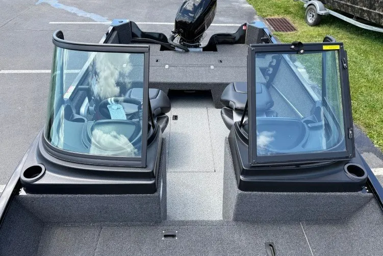Slide: The Image of 2026 Crestliner 1650 Kodiak WT boat interior with open windshield and seating. - 6