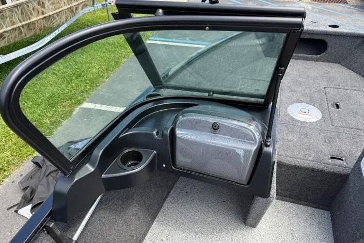 Slide: The Image of 2026 Crestliner 1650 Kodiak WT boat interior with windshield and storage compartment. - 8