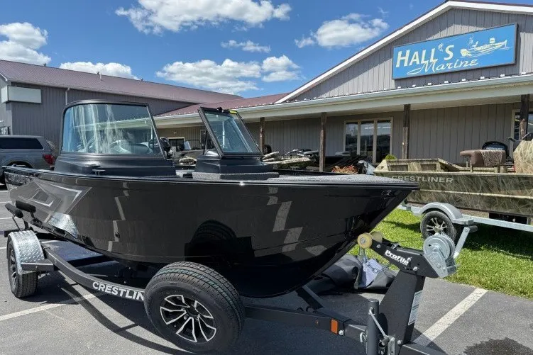Slide: The Image of 2026 Crestliner 1650 Kodiak WT boat on trailer at Hall's Marine dealership. - 2