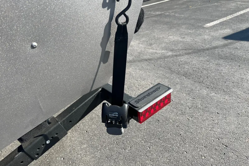 Slide: The Image of 2026 Crestliner 1650 Kodiak WT trailer with rear light and strap detail. - 17
