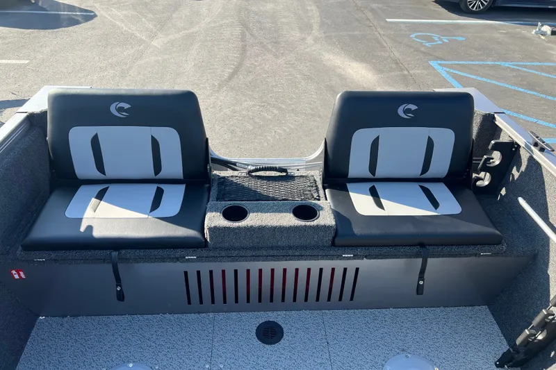 Slide: The Image of 2026 Crestliner 1650 Kodiak WT boat interior with dual seats and cup holders. - 15