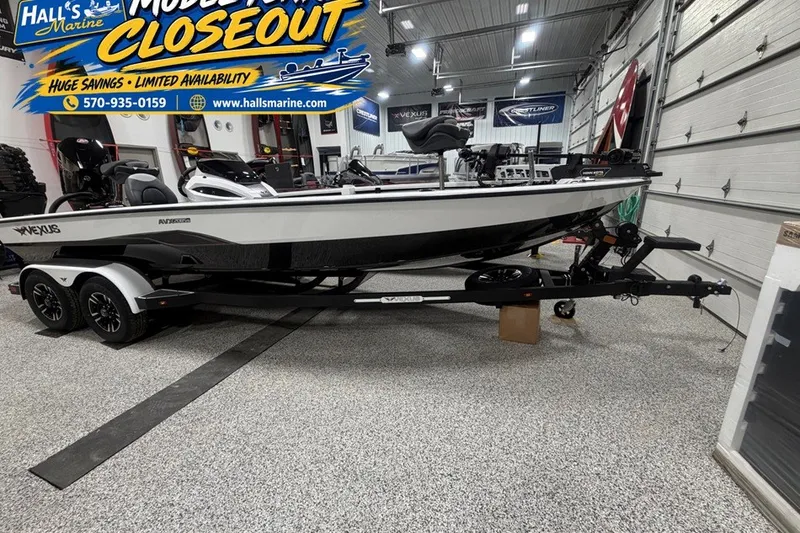 The Image of 2026 Vexus AVX 2085S boat on trailer in showroom, model closeout sale. - 0