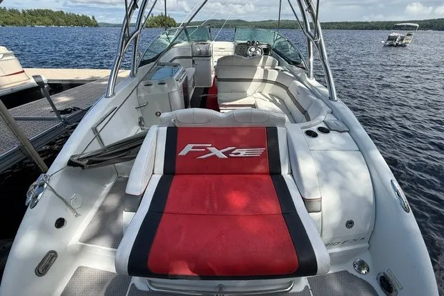 Slide: The Image of 2011 Formula 310 FX5 Bowrider on a lake, featuring spacious seating and sleek design. - 13