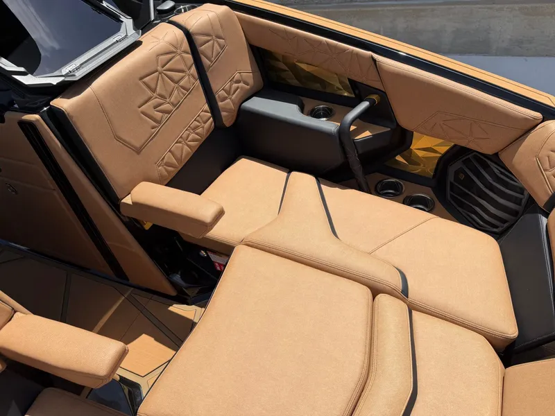 Slide: The Image of Luxurious beige upholstery in the interior of a 2027 Nautique Super Air Nautique G23 Paragon boat. - 33