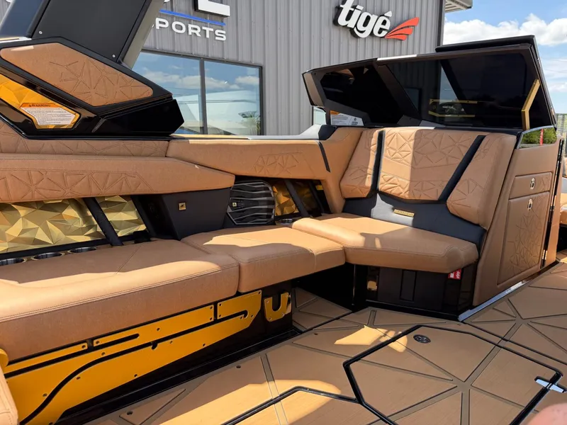 Slide: The Image of The image shows the luxurious interior of a Nautique Super Air Nautique G23 Paragon with elegant brown upholstery. - 18