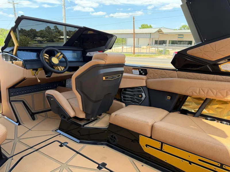 Slide: The Image of The interior of a luxury boat with beige seating and a modern helm station. - 21