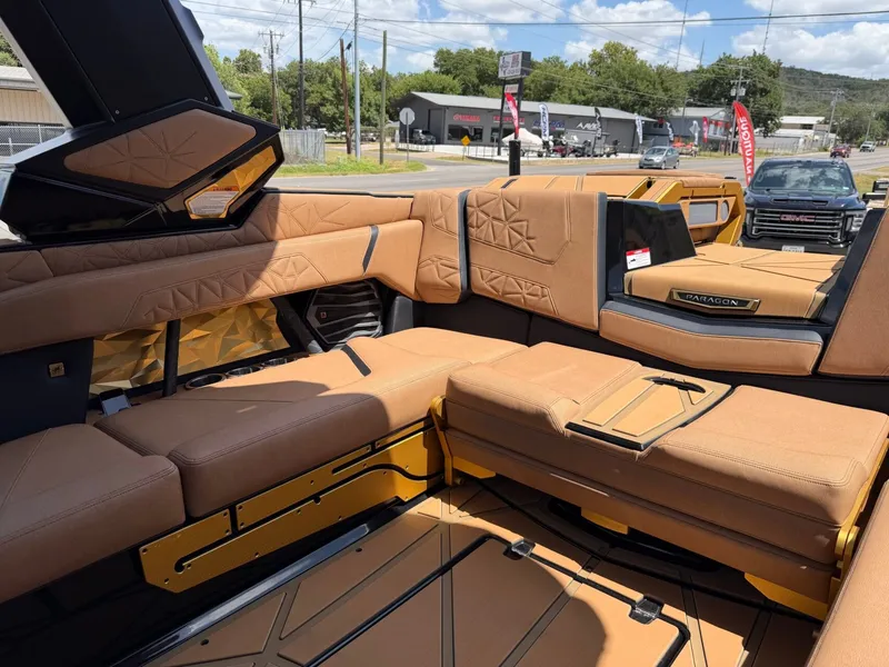 Slide: The Image of The image shows the luxurious interior of a Nautique Super Air Nautique G23 Paragon with beige upholstery. - 20