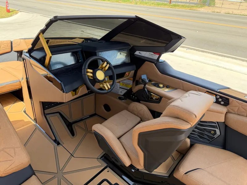 Slide: The Image of The image shows a modern boat cockpit with luxurious beige seating and a sleek dashboard. - 24