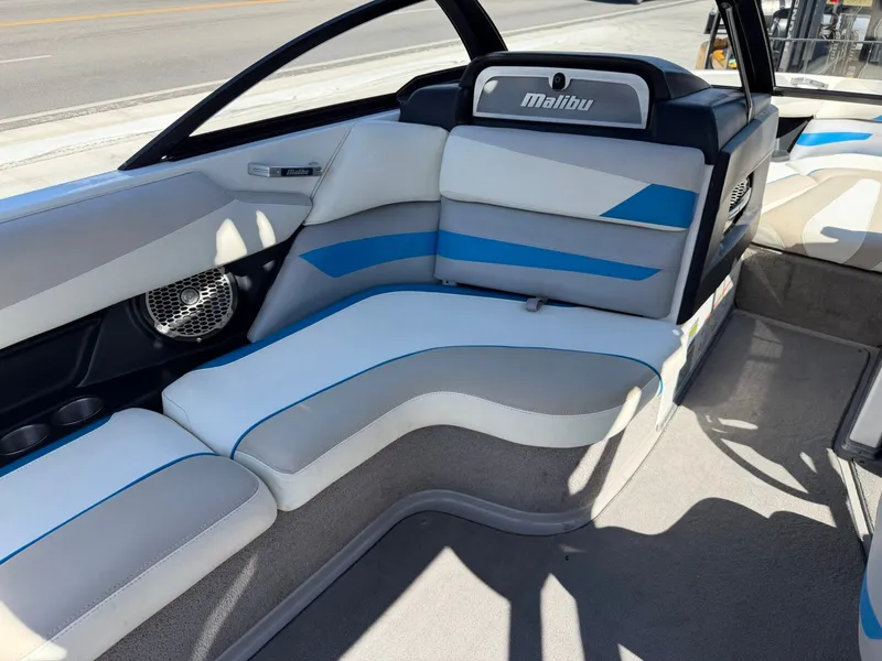 Slide: The Image of The image shows the interior of a 2016 Malibu Wakesetter 23 LSV with blue and white seating. - 11