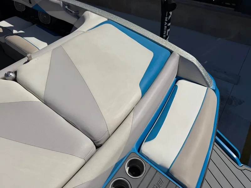 Slide: The Image of The image shows the seating of a 2016 Malibu Wakesetter 23 LSV with blue accents. - 9