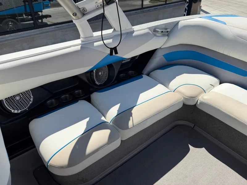 Slide: The Image of Interior of a 2016 Malibu Wakesetter 23 LSV with white and blue seating. - 14