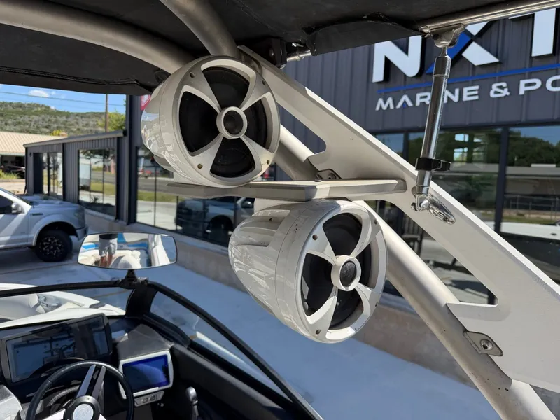 Slide: The Image of Close-up of speakers on a 2016 Malibu Wakesetter 23 LSV, overlooking the cockpit area. - 15