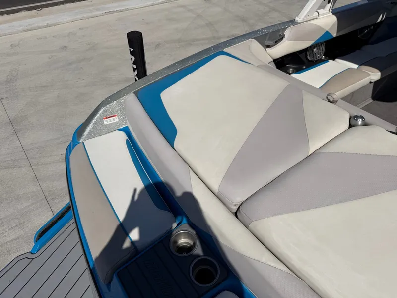 Slide: The Image of The image shows the rear of a 2016 Malibu Wakesetter 23 LSV with blue and gray upholstery. - 8