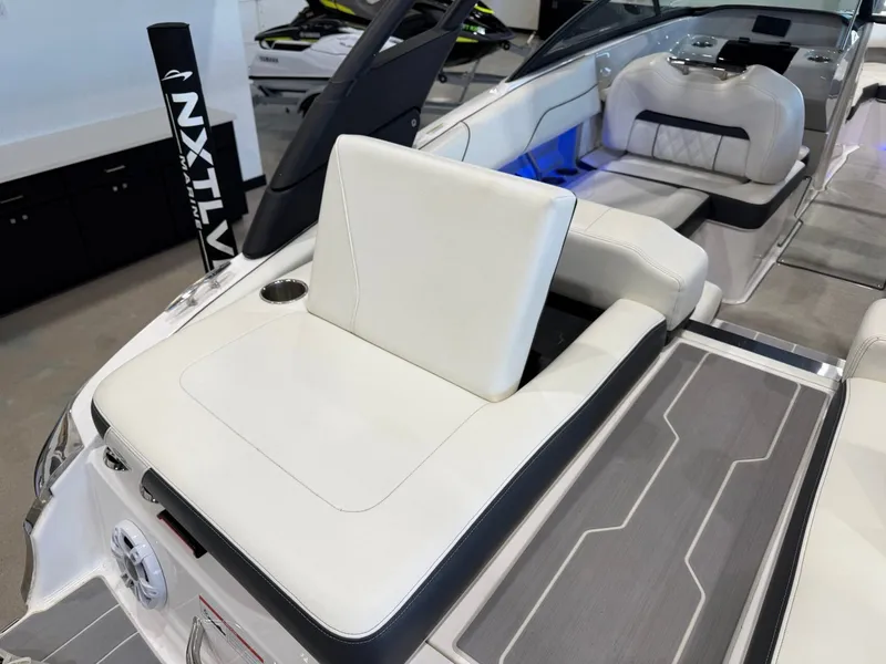 Slide: The Image of The image shows the cockpit of a 2022 Regal LS2 Surf with white upholstery. - 14