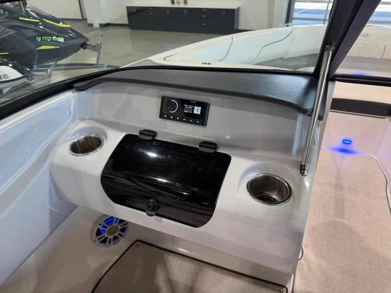 Slide: The Image of The image shows the cockpit of a 2022 Regal LS2 Surf boat with modern controls. - 21