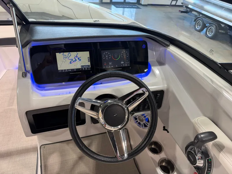 Slide: The Image of The image shows the cockpit of a 2022 Regal LS2 Surf with a modern helm and digital displays. - 23