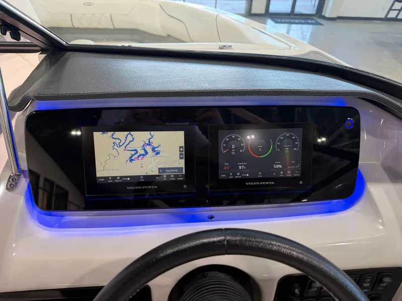 Slide: The Image of The image shows the dashboard of a 2022 Regal LS2 Surf boat with two digital displays. - 24