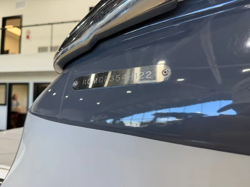 Slide: The Image of Close-up of a boat hull with a serial number on a metal plate. - 33