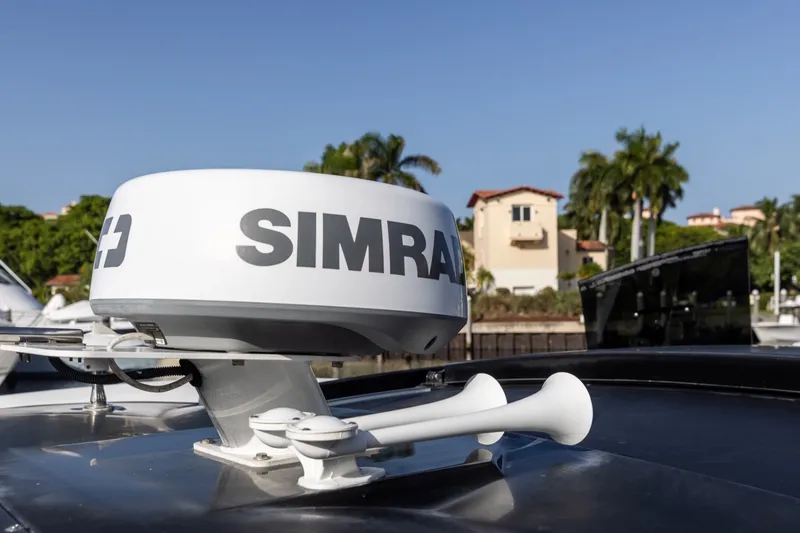 Slide: The Image of Simrad radar on 2021 Cruisers Yachts 42 GLS OB, docked with palm trees in background. - 28