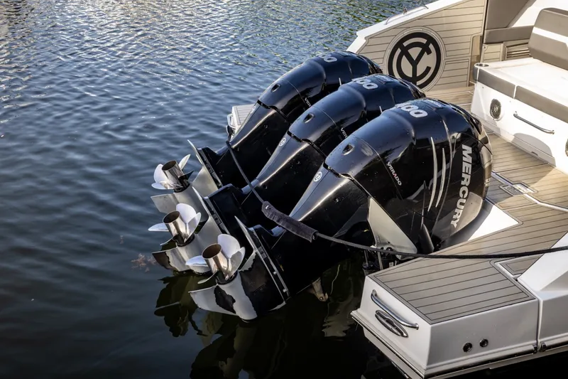 Slide: The Image of 2021 Cruisers Yachts 42 GLS OB with triple Mercury outboard engines on water. - 23