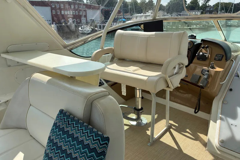 Slide: The Image of Interior of 2004 Carver 570 Voyager Pilothouse with helm seat and control panel. - 7