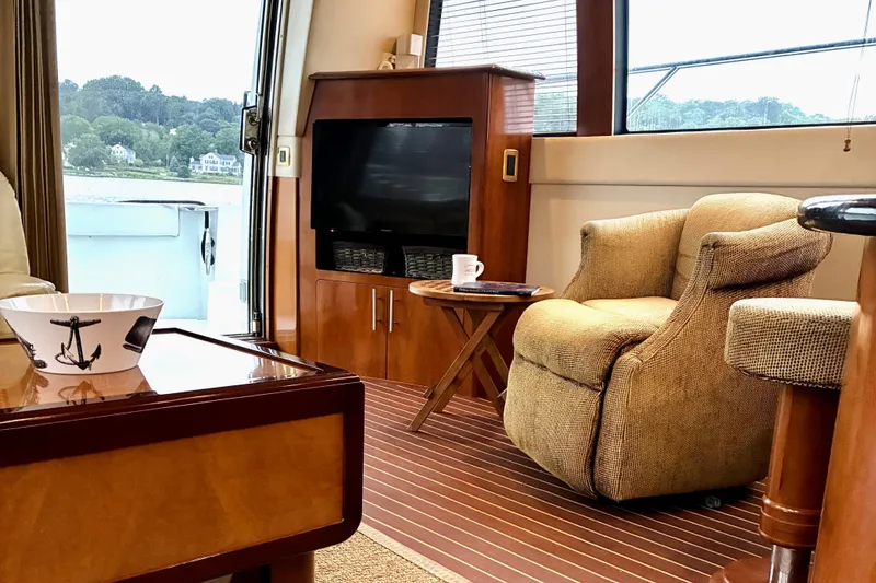 Slide: The Image of Luxurious interior of 2004 Carver 570 Voyager Pilothouse with cozy seating and elegant decor. - 27